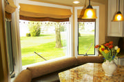 kitchen faux leather window seat cushions with gold chenille bolsters
