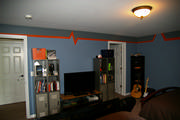 boys room painting in blue, grey and orange
