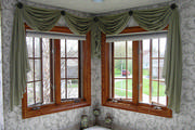 Sage green scarf window treatment  in bathroom with pleated shades
