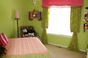girls pink and green window treatment with trim and tassels
