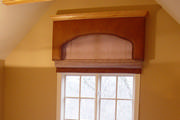 ostrich skin leather cornice with crown molding and roman shade on window

