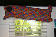 Fun and funky cornice shaped top and bottom with glass bead trim in a sewing room window.
