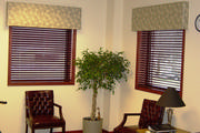 Leaf fabric covered cornices over wood blinds help with sun control in this waiting room.
