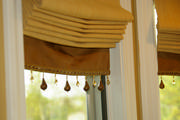 Close up of the roman shades show a beautiful banding with trim from Robert Allen
