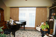 Embroidered Faux Silk draw drapes over sheers give this music room just the right amount of privacy.
