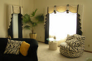 Beautiful cream and black drapes, swags, cascades and sheers are exactly what this client wanted for her living room.
