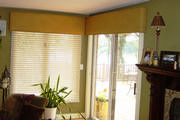 Bowed faux ostrich skin cornices for corner windows gives an architectural element to the room. 
