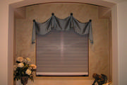 Blue silk window treatment in bathroom with motorized shade

