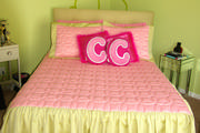Girls pink quilted bedspread and pillows shams with gathered skirt
