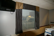 Beautiful faux silk drapery help the hospital room feel more like home. 
