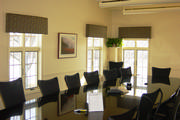 These cornices on the office windows bow out to mimic the shape of the table.
