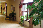 Hotel lobby drapery in camel with attached red silk valance.

