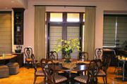Gold linen drapes with banding around the entire panel and table runners in coordinating fabrics
