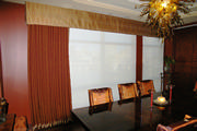 Gold and red dining room with damask drapes to match along with the gold valance.
