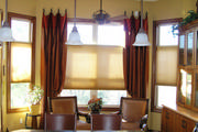 Soft simple drapery panels with band along top in a faux suede and rest of panel in a chili red jacquard.
