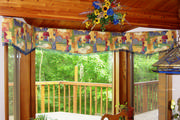 A whimsical cornice in a kitchen bay window with glass bead trim.
