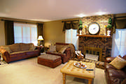 Plantation shutters, beautiful drapes and valances and recovered furniture transformed this living room space.
