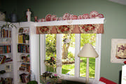 A simple box pleat floral valance lends itself to the "shabby chic" family room.
